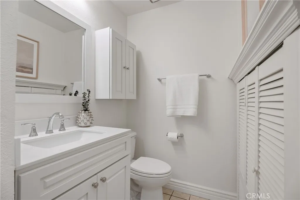Main floor bath with SHOWER.  New vanity and upper cabinet. Large storage space under the stairs.