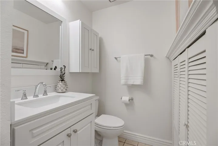 Main floor bath with SHOWER.  New vanity and upper cabinet. Large storage space under the stairs.