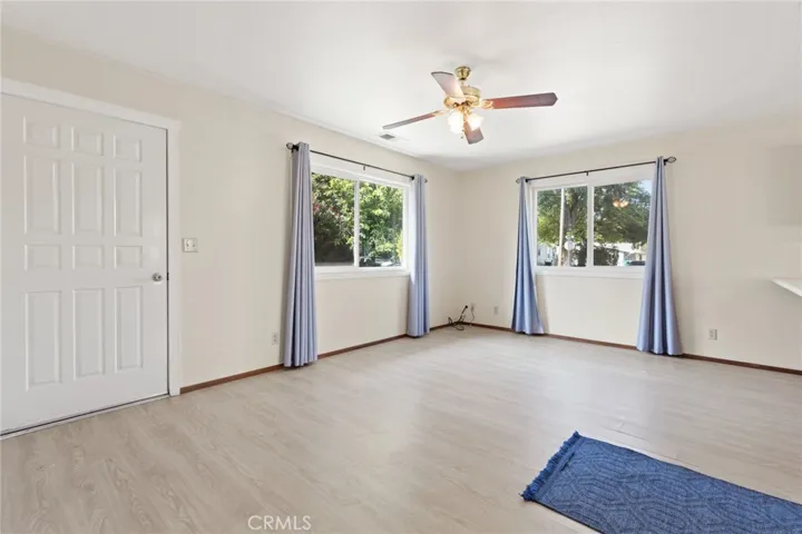 Duplex - 1700 Sherman - Another view of the living room with upgraded windows, and laminate flooring.