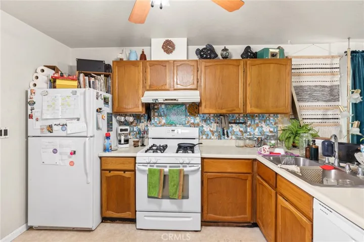 Duplex - 1701 Sheridan - View kitchen with refrigerator, gas stove and dishwasher.