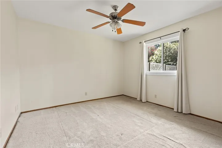 Duplex - 1700 Sherman  - View of Bedroom 1 with ceiling fan, carpet and upgraded window.