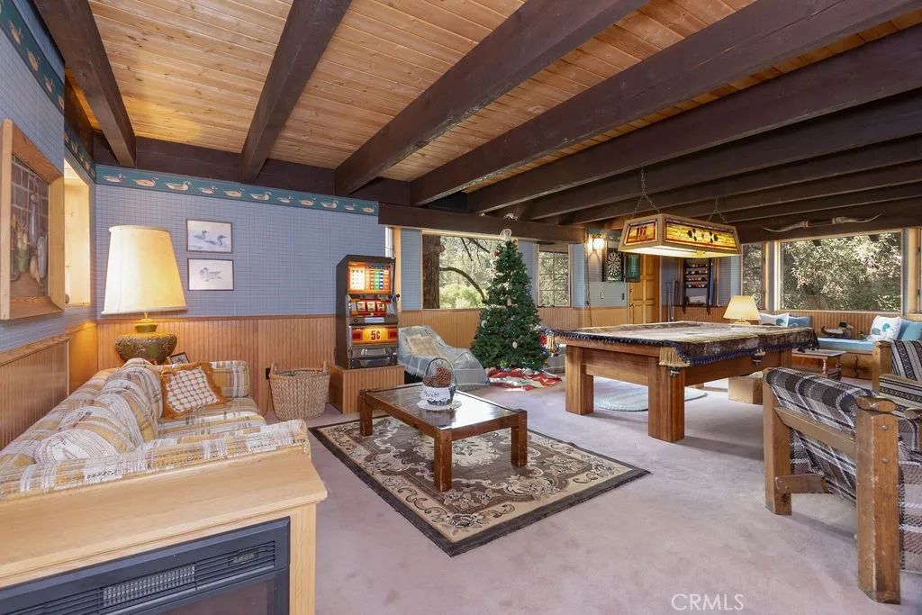 Enter the front door into the game room.