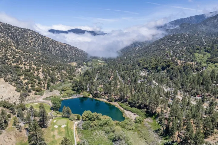 The house is just below the center of the photo. which looks east.