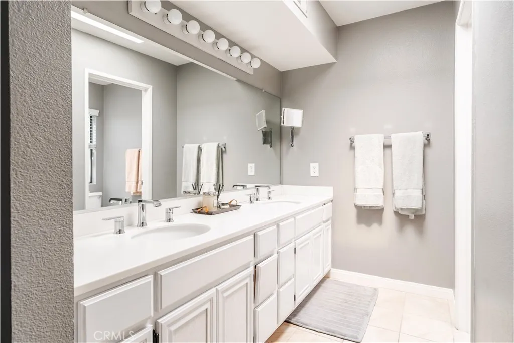 Primary ensuite bathroom with double sinks