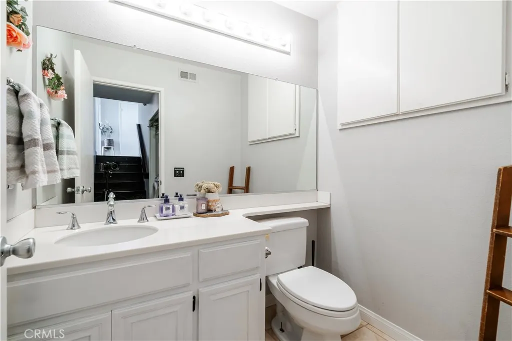 Downstairs powder room with additional storage area