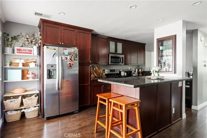 Kitchen with island, bar seating, open to the dining room