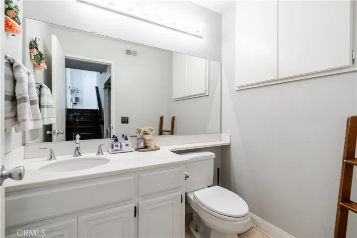 Downstairs powder room with additional storage area