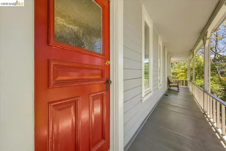 Vibrant paneled entry door with frosted glass accent
