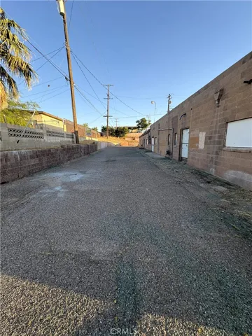 Behind the building.
