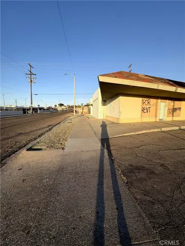 Looking down street and corner of the building.