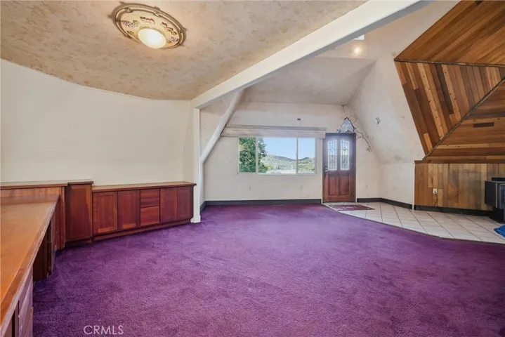 Main Level living room with built in desk and storage