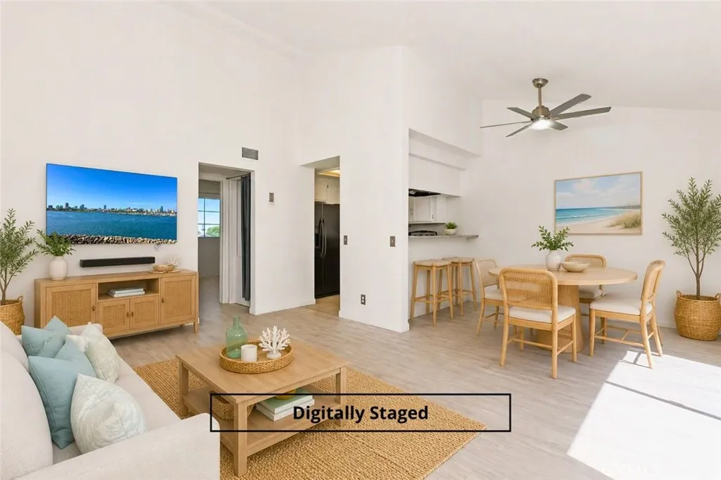 Open floorplan is light & bright with high ceilings - image digitally staged.