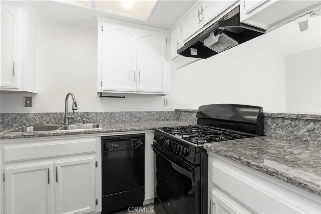 Gas stove is a chef's delight, plenty of cupboards, and a compact dishwasher as well.
