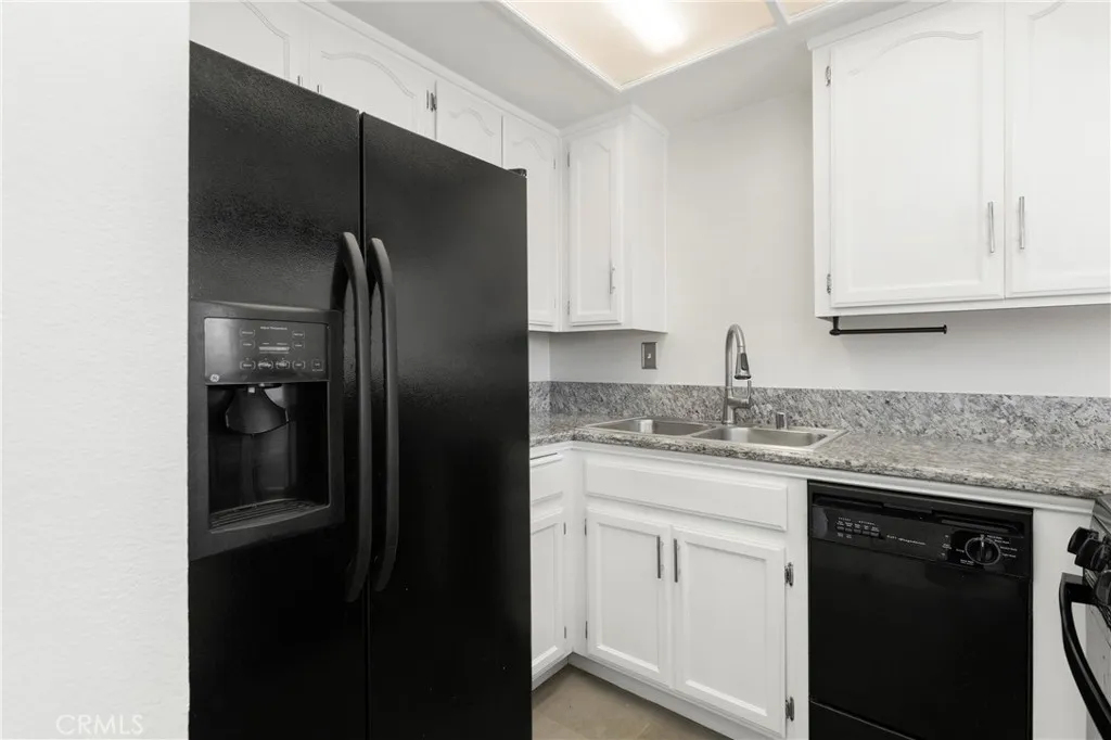 Remodeled kitchen offers matching appliances and a water filtration system.