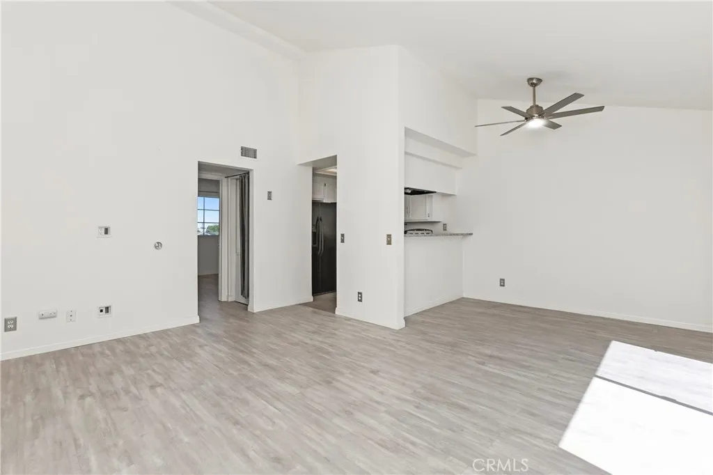 Includes space for mounted TV, living, dining, and breakfast bar.