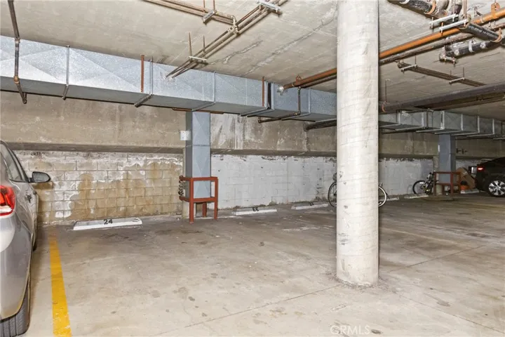 TWO parking spots in the subterranean garage: #24 and #EE