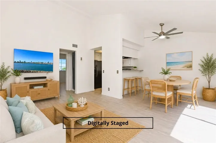 Open floorplan is light & bright with high ceilings - image digitally staged.