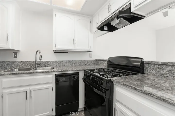 Gas stove is a chef's delight, plenty of cupboards, and a compact dishwasher as well.