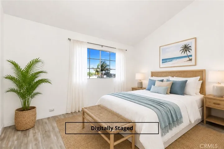 Bedroom has high ceilings and palm tree views. Image virtually staged.