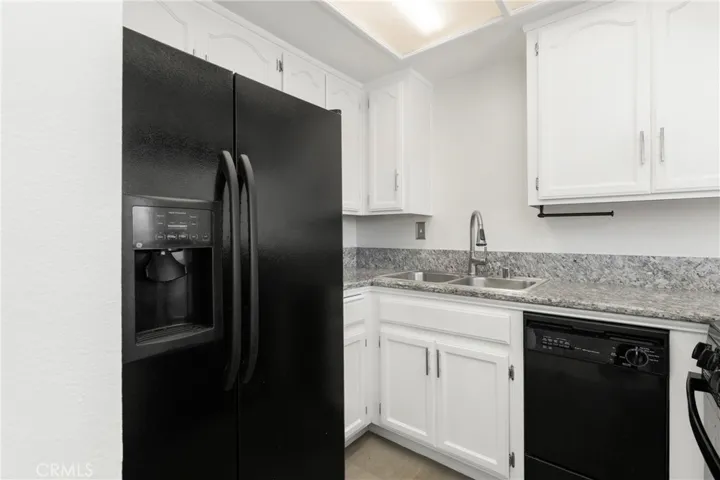 Remodeled kitchen offers matching appliances and a water filtration system.