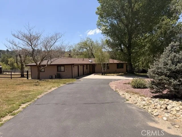 Large, paved, U-shaped driveway and Two Car garage.