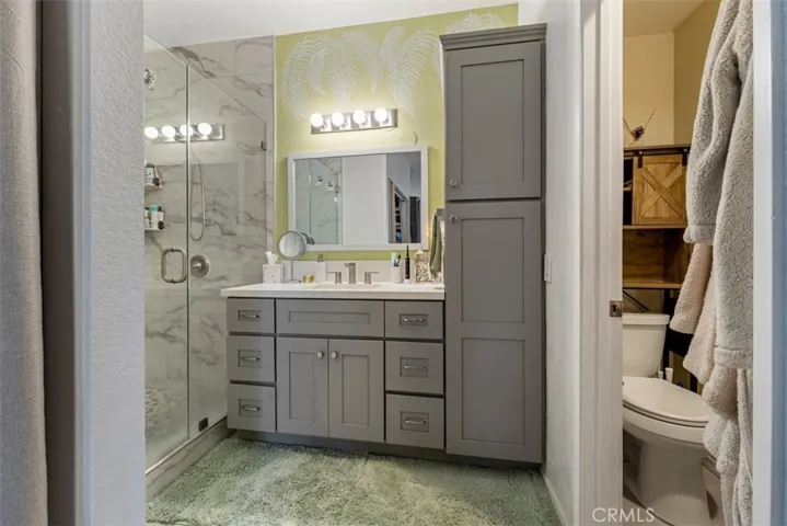 Bathroom with walk in shower and lots of closet/storage space