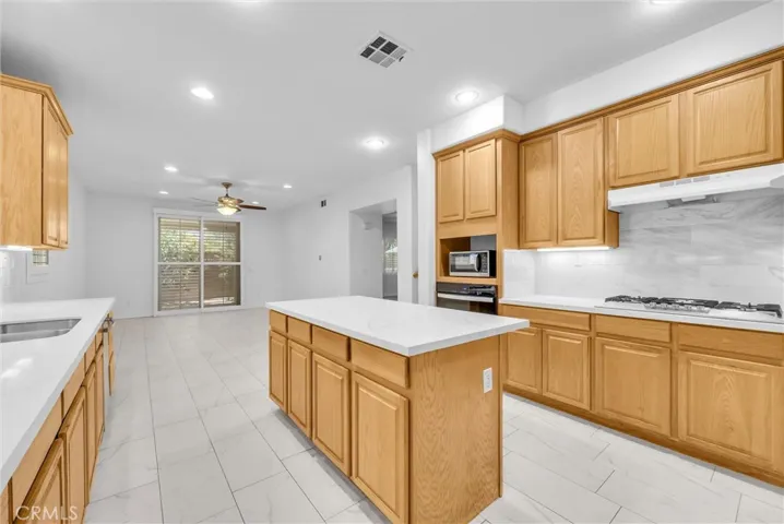 Kitchen with quartz island and countertops.