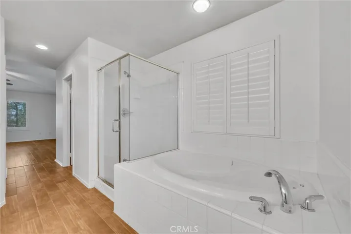 Separate shower and jetted tub.