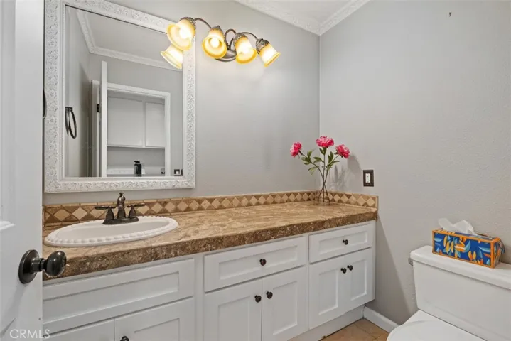 Spacious bathroom with an extended vanity, ample counter space, and a bright, well-maintained design.