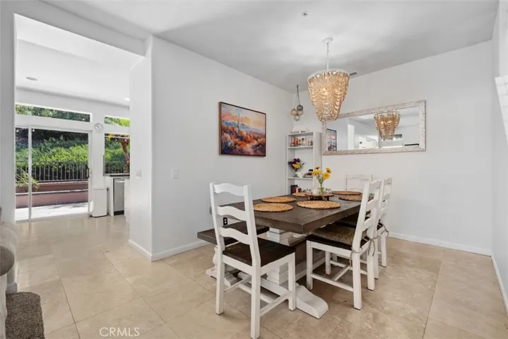 Dedicated dining area with stylish lighting and an open layout, ideal for casual meals or hosting family and friends.