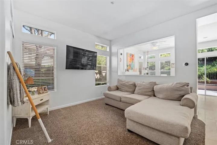 Another view of the living room highlighting the open-concept layout and easy connection between indoor living and outdoor views.