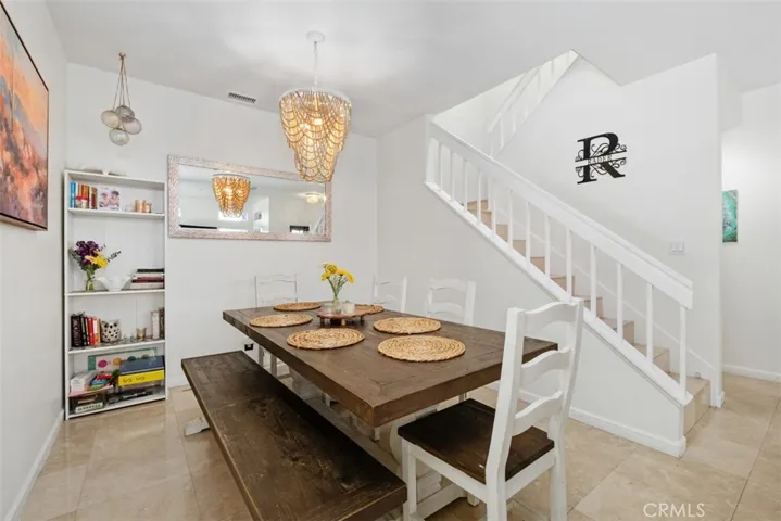 Dining area viewed from another angle, showcasing the spacious layout and connection to the home's main living areas.