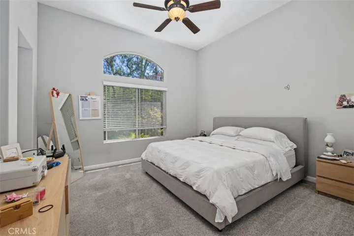 Comfortable primary bedroom with soft natural light, neutral finishes, and ample space to create a relaxing retreat.