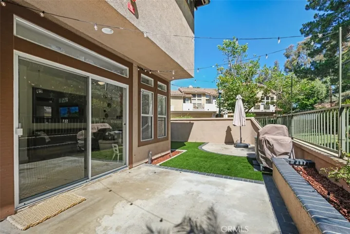 Seamless indoor-outdoor connection highlighted by large sliding glass doors that open directly to the patio and backyard.