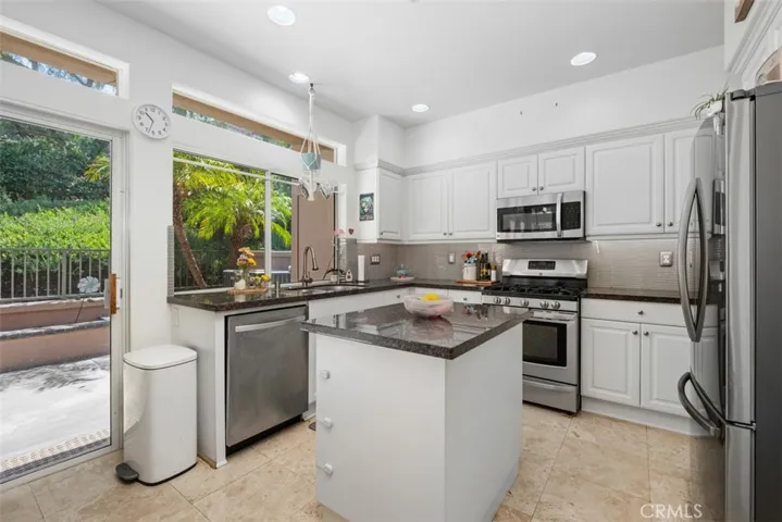 Well-appointed kitchen featuring ample cabinetry, generous counter space, and an efficient layout for daily meal preparation.