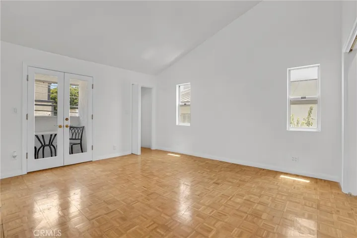 Primary Bedroom with dramatic vaulted ceilings