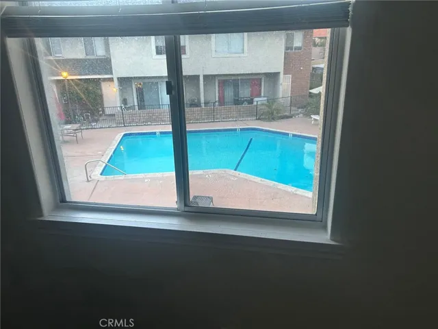 Bedroom 2/Overlooking Pool Area