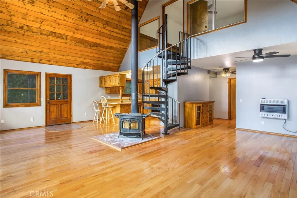 stunning spiral staircase leads to the primary bedroom.