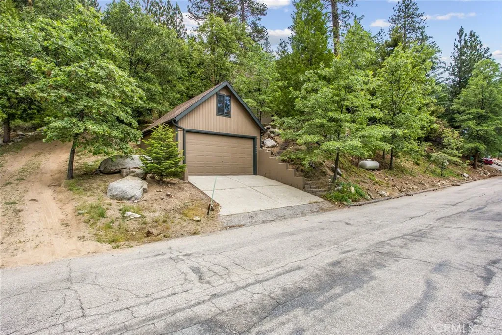 Two car detached garage with an an additional finished area above the garage that can be used as an office.