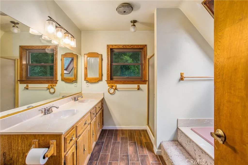 primary bathroom offers a separate shower & bathtub