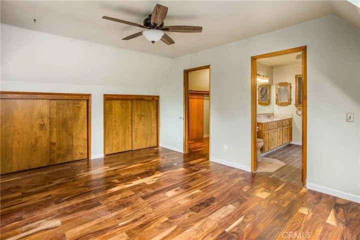 primary bedroom offers a walk in closet plus two additional smaller closets