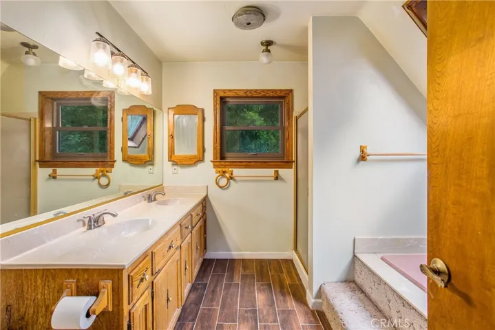 primary bathroom offers a separate shower & bathtub