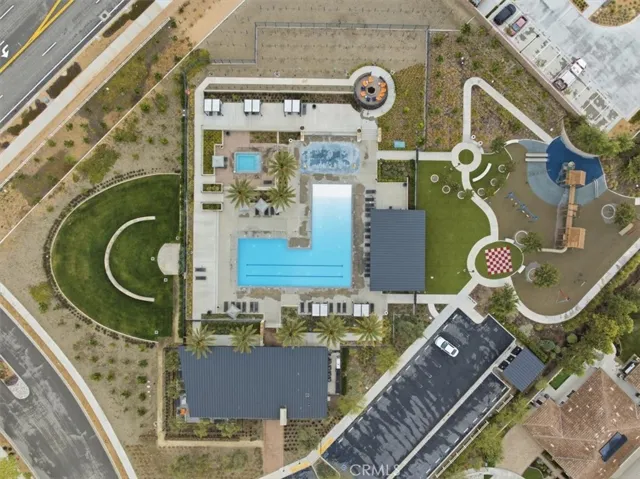 Aerial Community View of Pool, Splash Pad, BBQ, and Playground by the Fire Station
