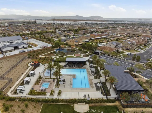 Aerial Community View of Pool, Splash Pad, BBQ, and Playground by the Fire Station