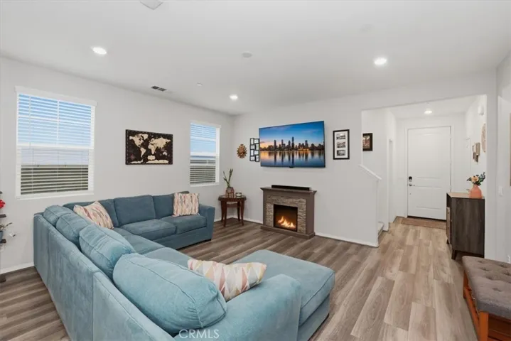 Living Room - “Digitally Altered Image by adding an image on the TV and a fire to the electric fireplace furniture piece"