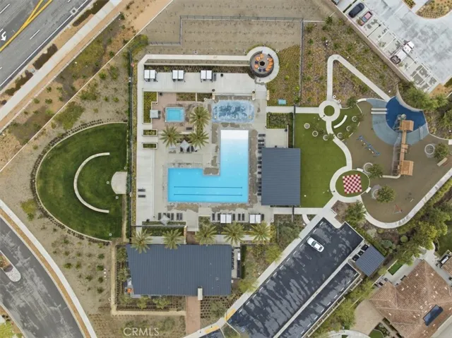 Aerial Community View of Pool, Splash Pad, BBQ, and Playground by the Fire Station