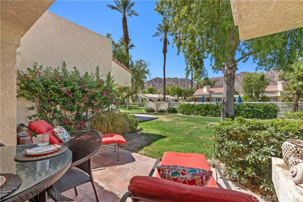 Back patio with beautiful views and close proximity to one of the community pools and spas.