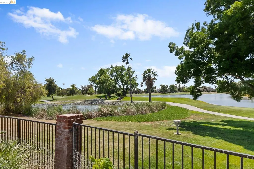 View of yard with a water view