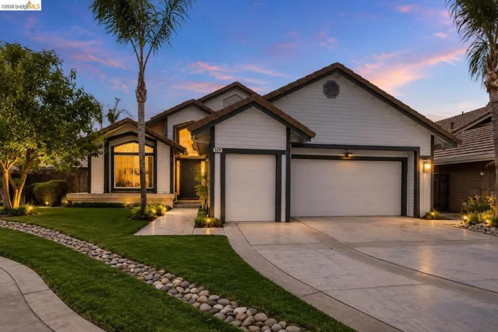 Modern exterior with white siding and dark trim