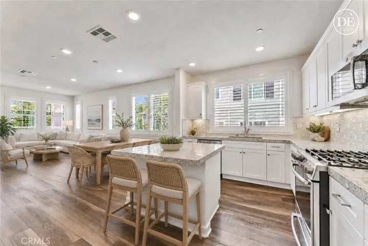 E-staging the living and kitchen area